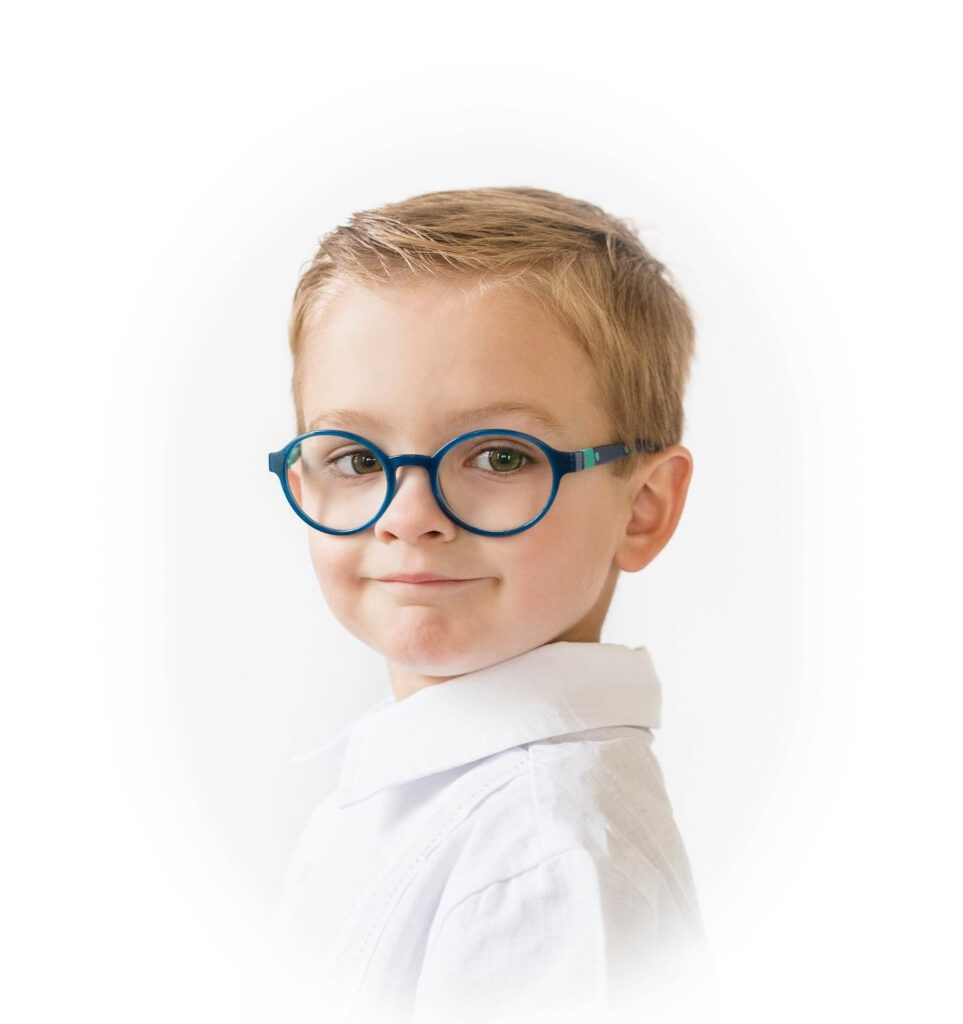 An heirloom portrait of a young boy wearing glasses, captured in a timeless, classic style by JCrane Photography, showcasing the child’s personality and charm. JCrane Photography, Raleigh heirloom portraits, Raleigh portrait photography.